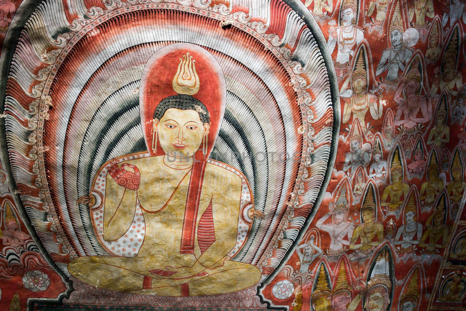 Valuable tempera paintings with Buddha image on the cave ceiling dating from the 18th century in Dambulla Cave Temple, Sri Lanka