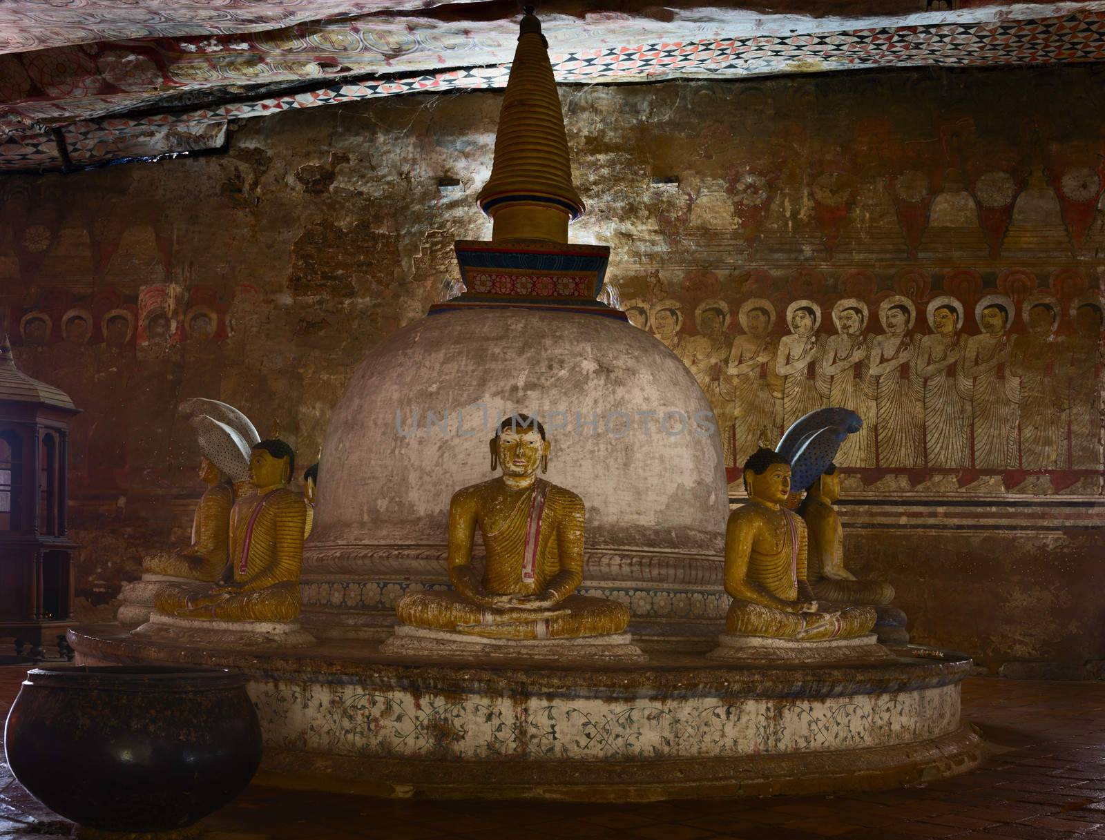Stupa with ancient Buddha statues in Dambulla Cave Temple, Sri Lanka