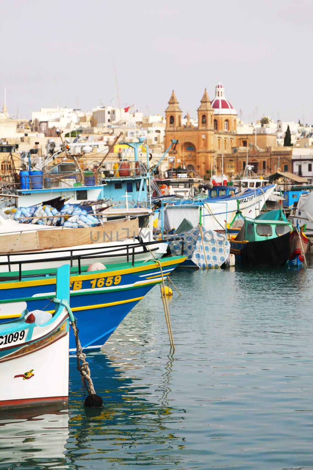 Detail of Marsaxlokk harbour in Malta, Europe, Mediterranean showing fishing boats