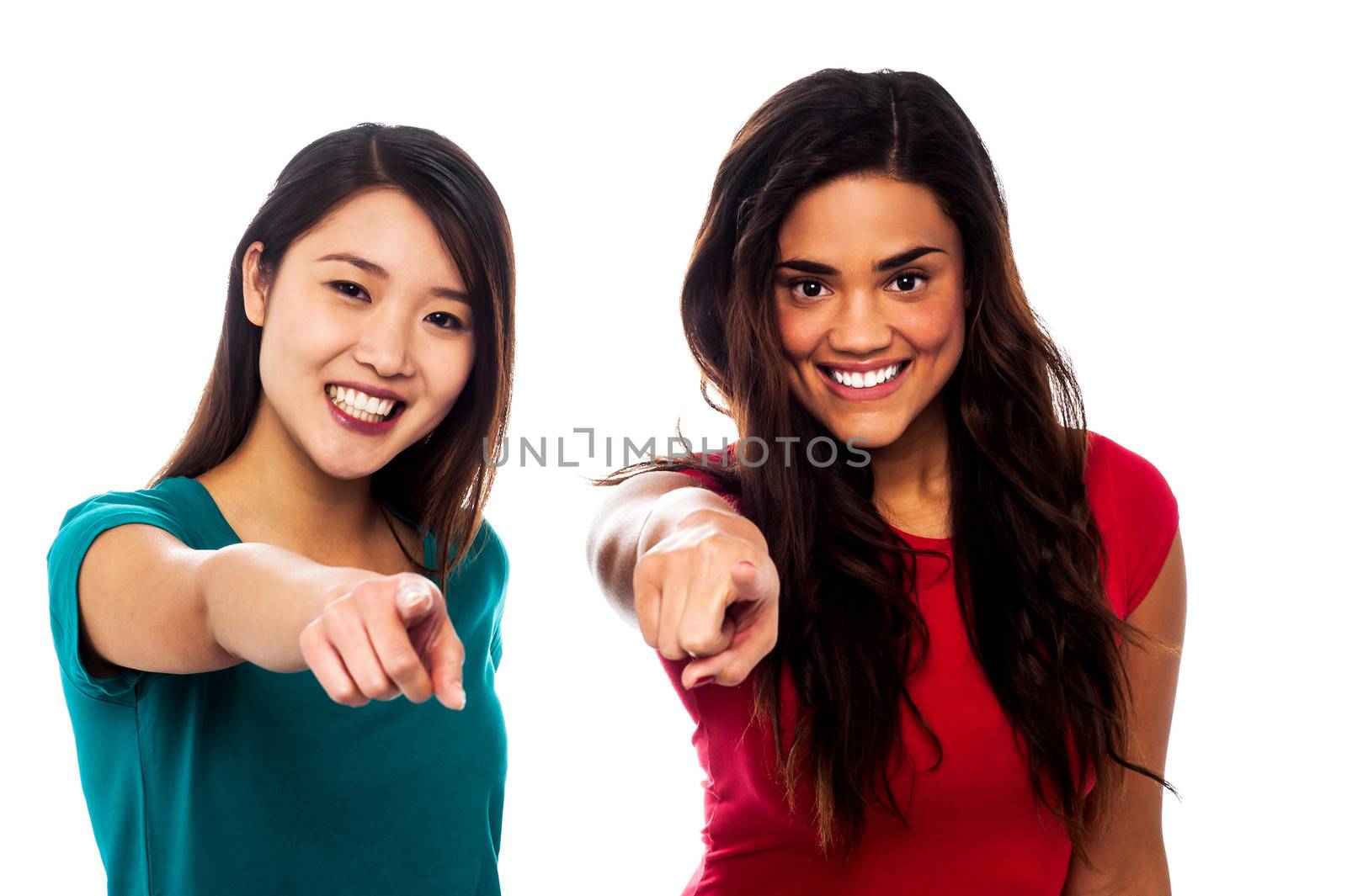 Pretty girls pointing finger towards you by stockyimages