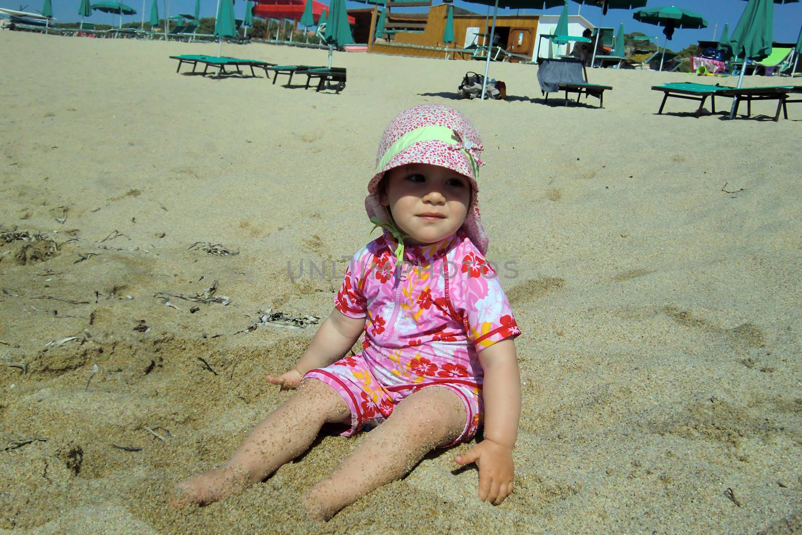 Portrait of little cute blond girl  on the beach by Flik47