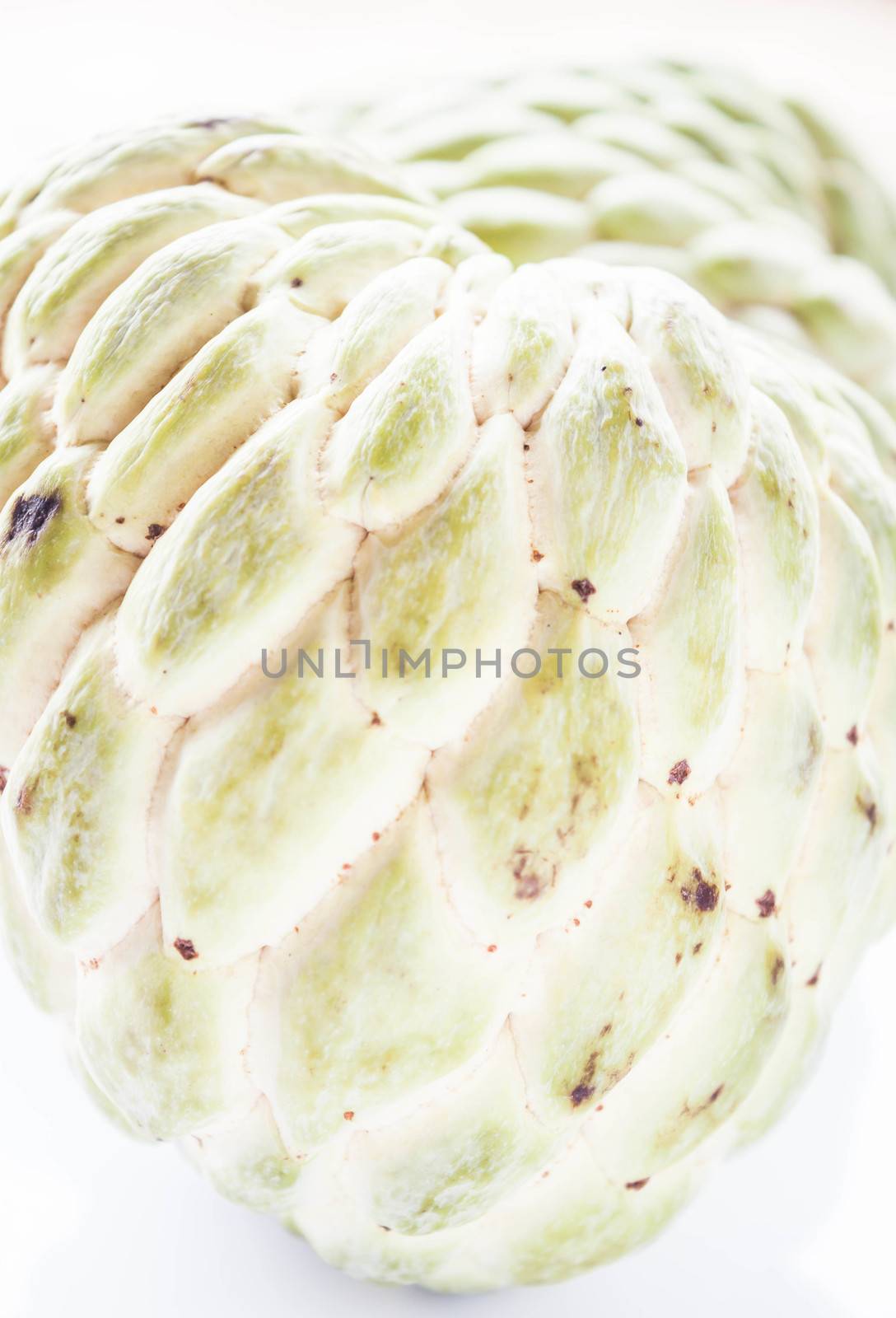 Close up green peel texture of custard apple  by punsayaporn