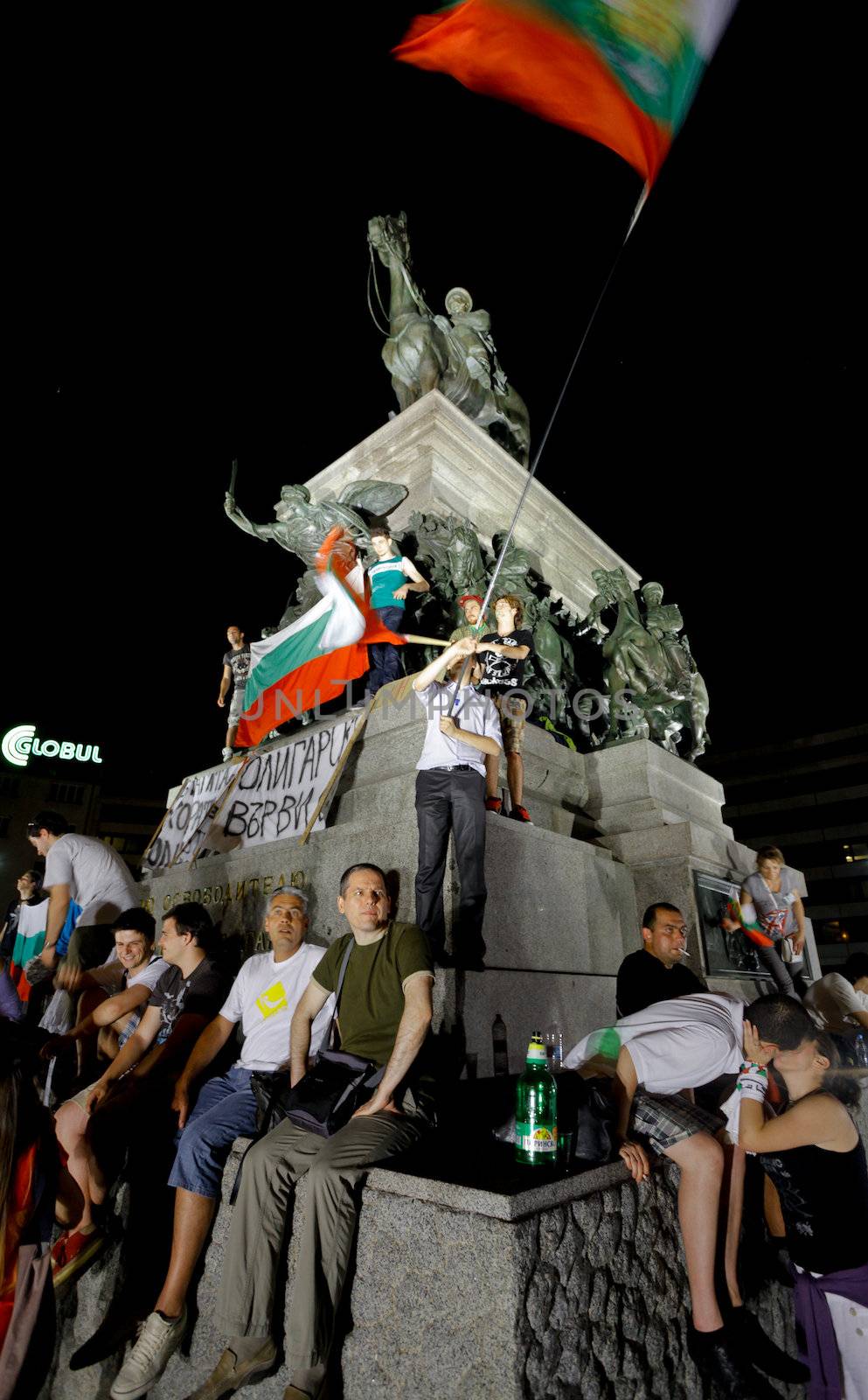 Sofia; Bulgaria - June 18, 2013: Bulgarians are protesting infront of the parliament, climbed on "King the liberator" monument, demanding their newly appointed socialist government step down.
The protests were originally sparked by the controversial appointment of businessman and MP Delyan Peevski as the new head of the State Agency for National Security.