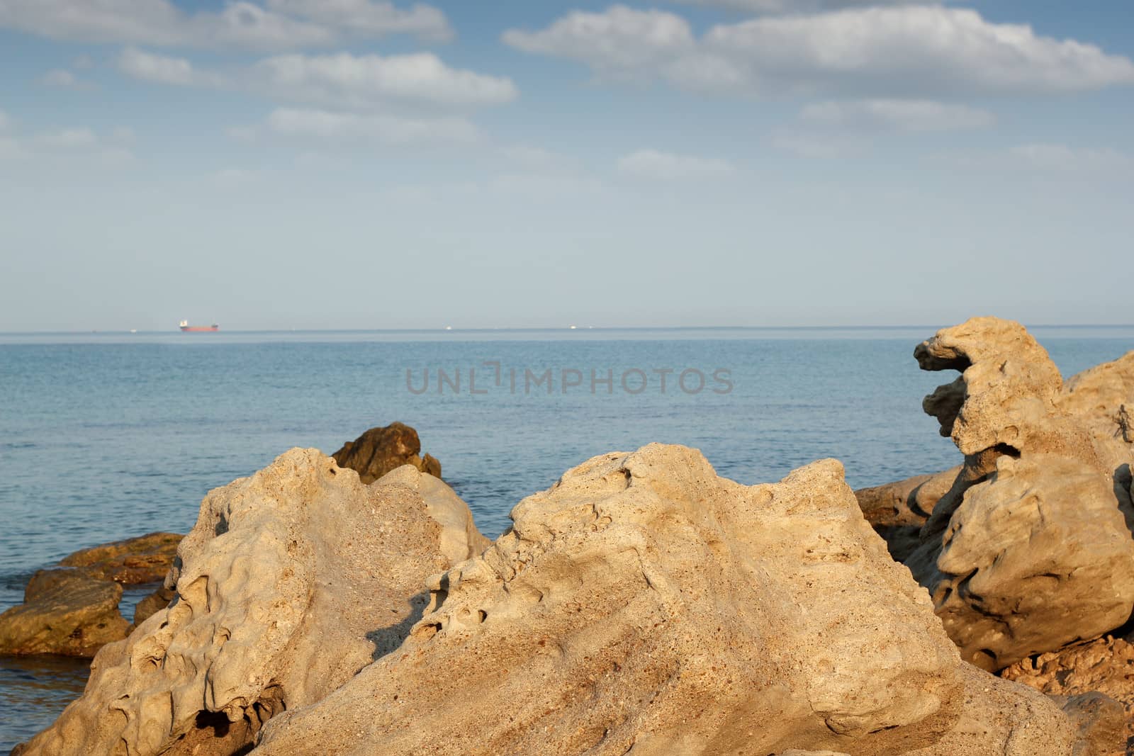 seascape with rocks and ship