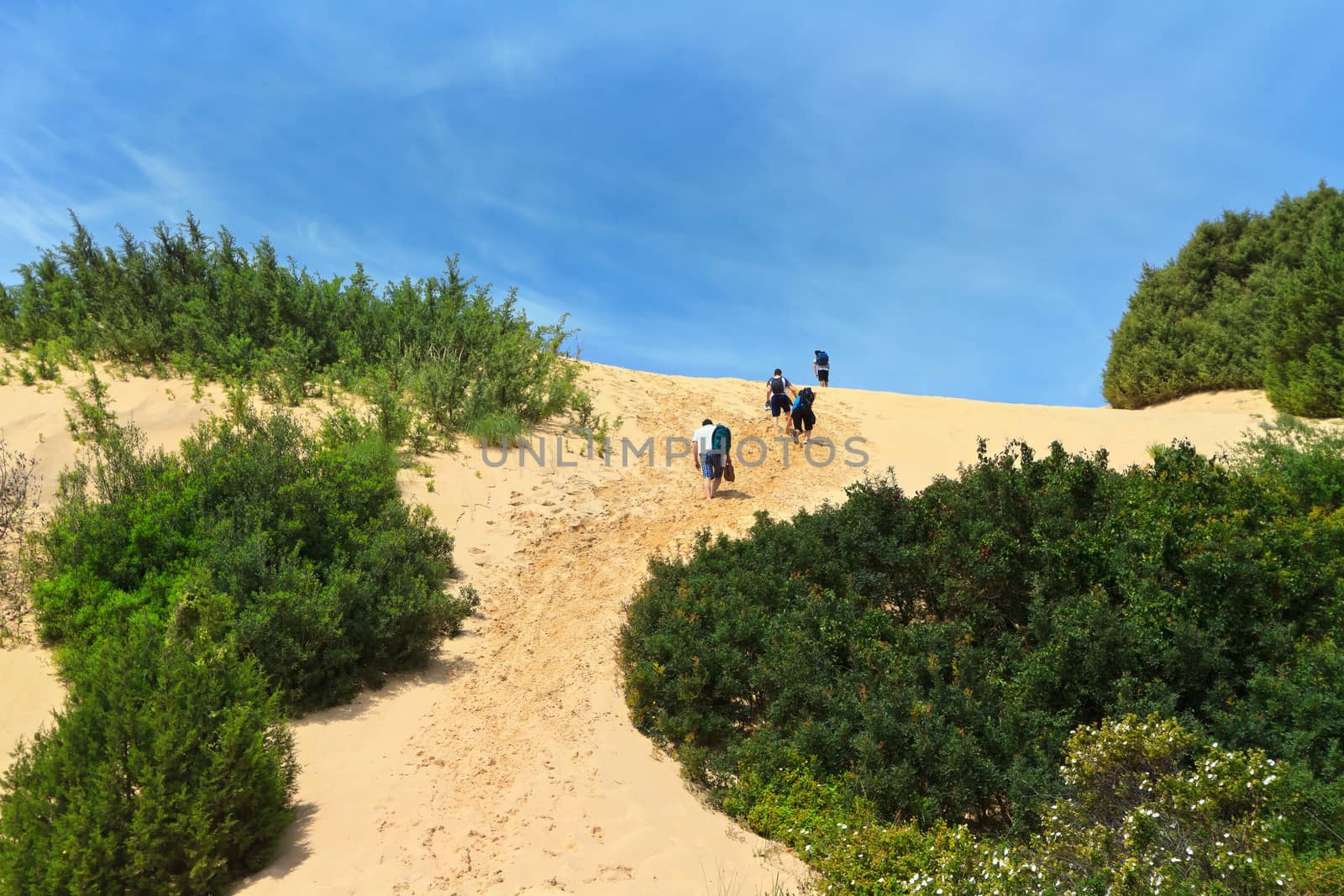 tourists in Piscinas dune in Costa Verde, southwest Sardinia, Italy