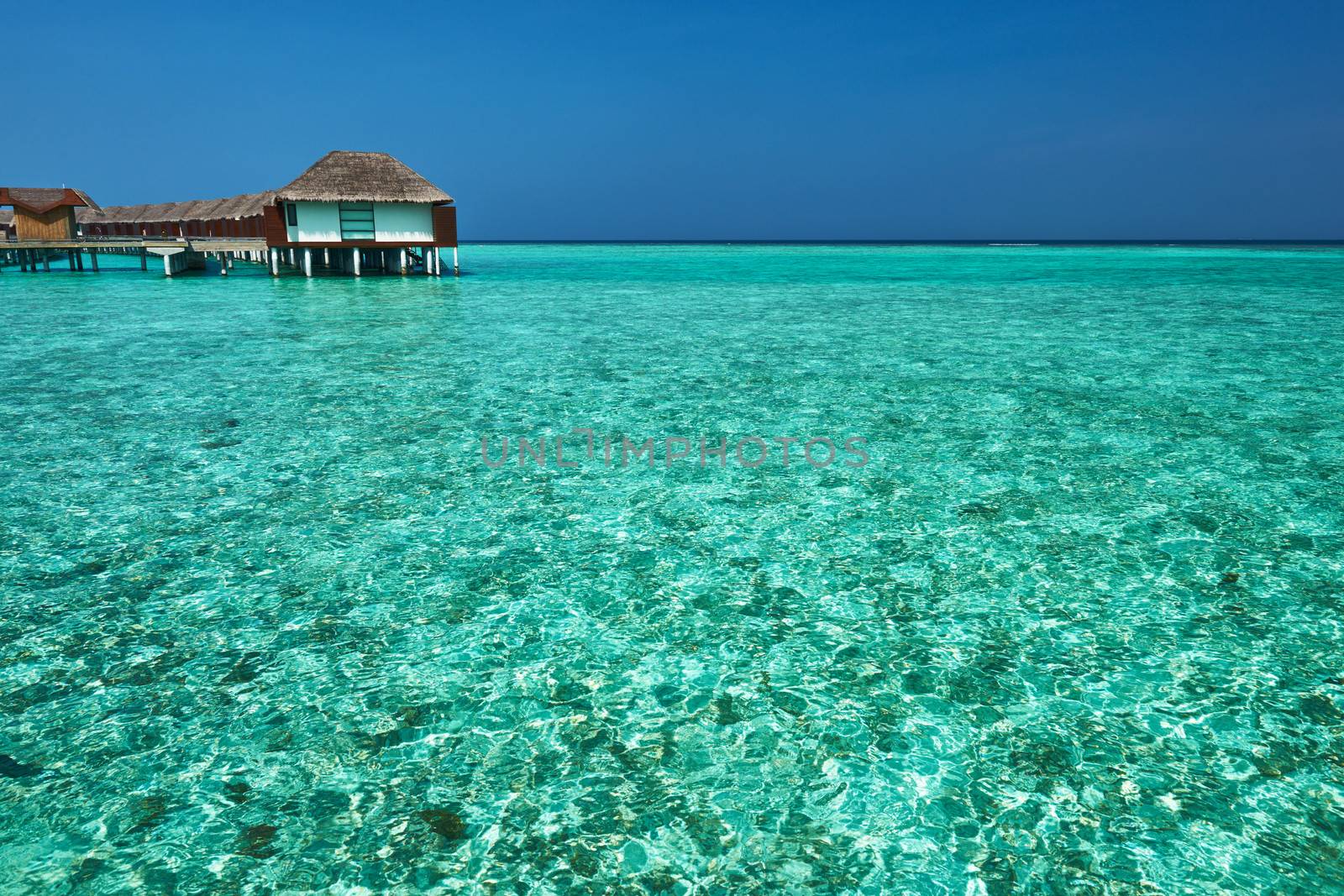 Beautiful beach with water bungalows at Maldives