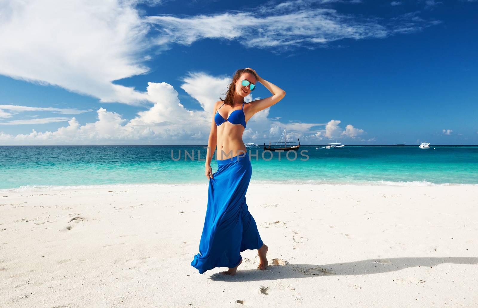 Woman in skirt at tropical beach