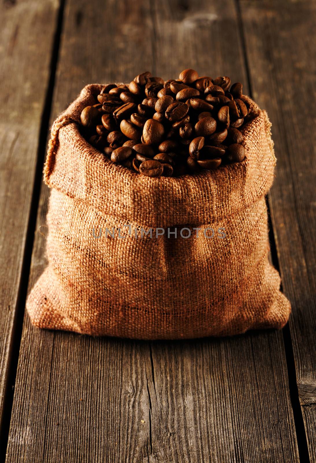 Coffee beans in bag on table by haveseen