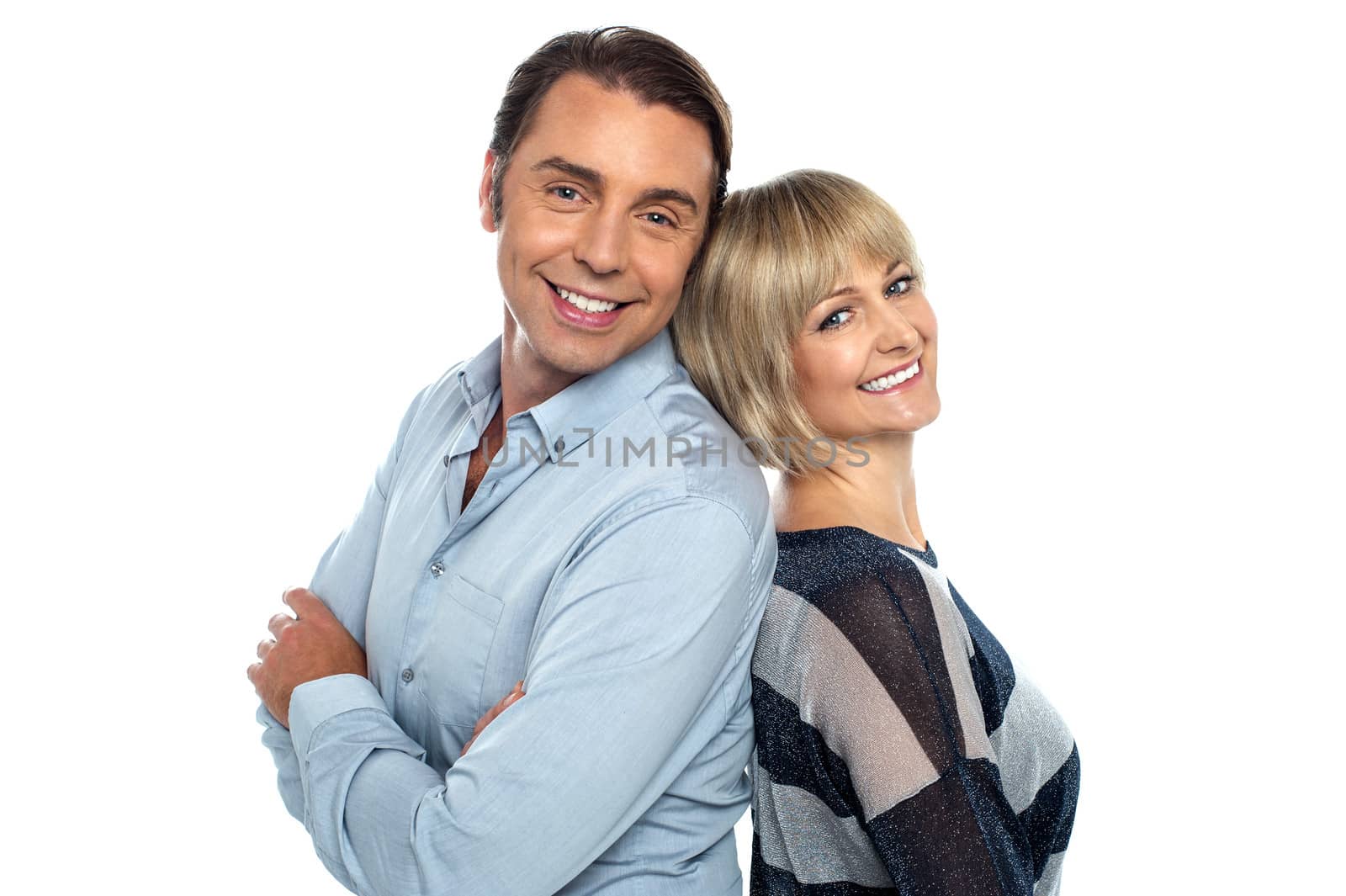 Isolated couple leaning against each other