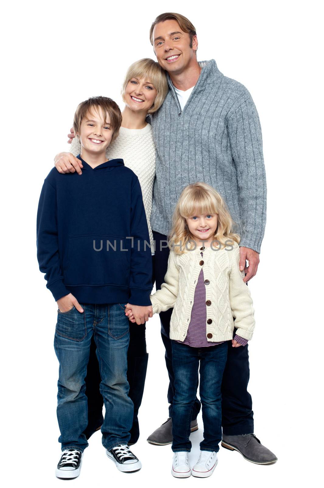 Affectionate family with children at studio by stockyimages