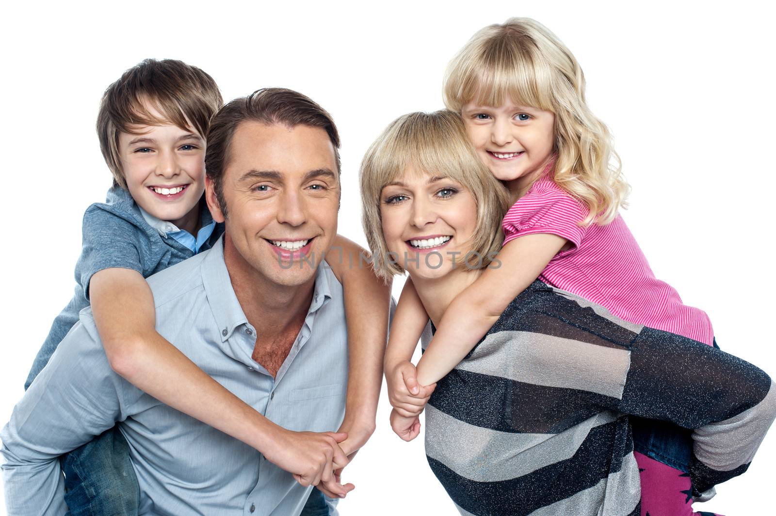 Portrait of friendly family of four in the studio