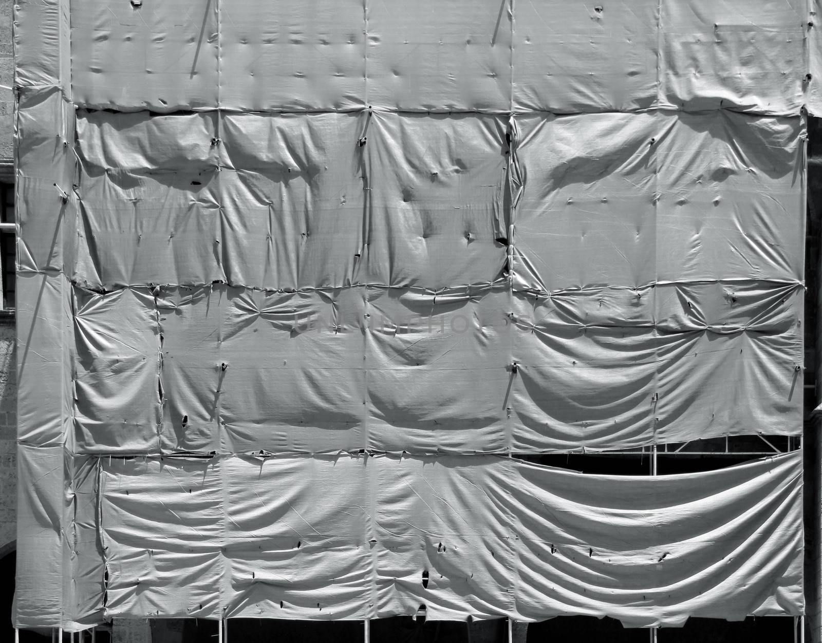 Wrinkled tarpaulin canvas background by anterovium