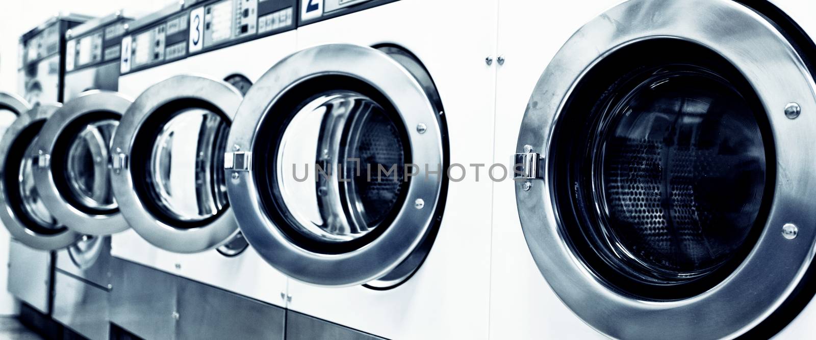 industrial washing machines in a public laundromat 
