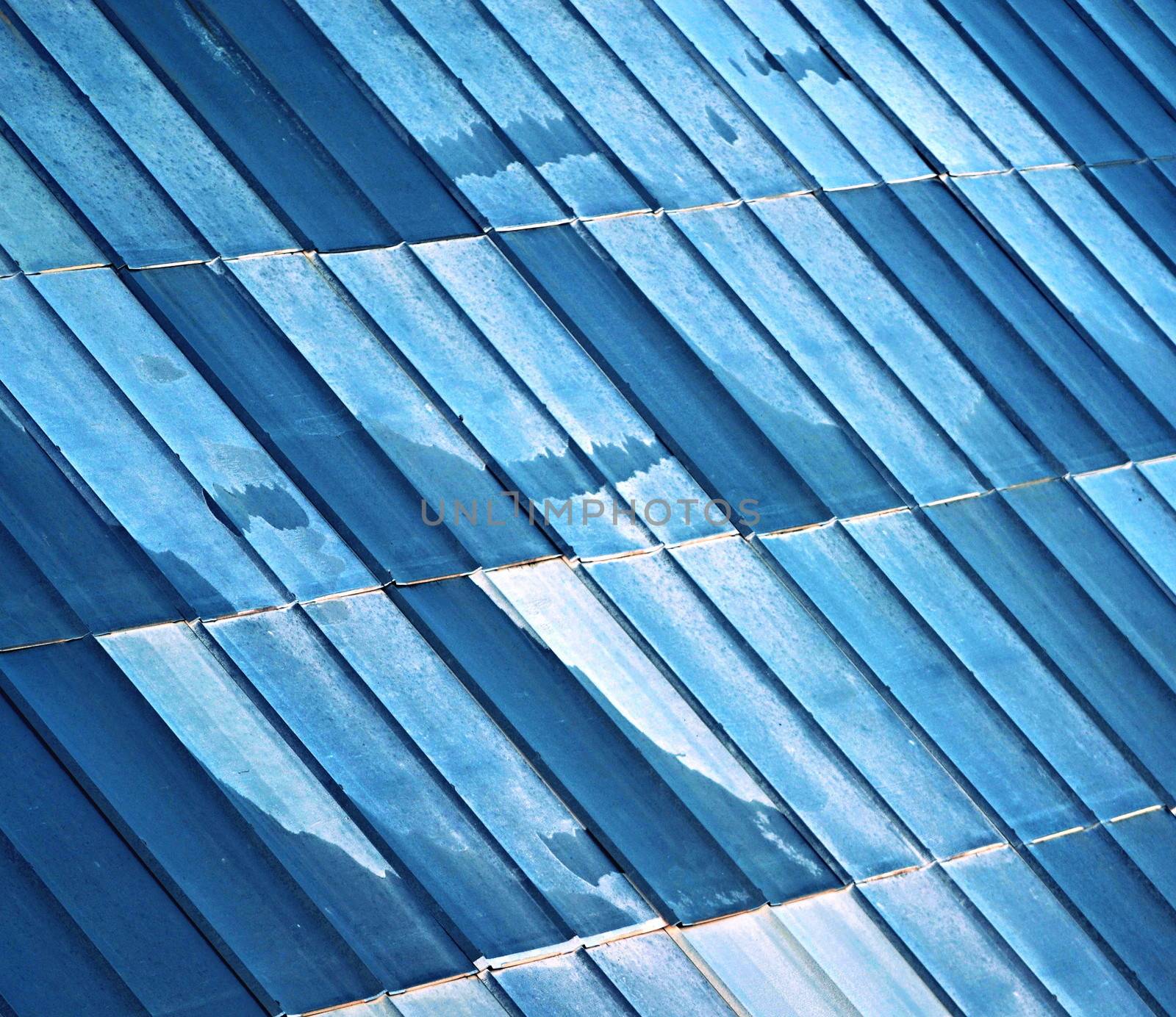 old metal tiled roof blue white color