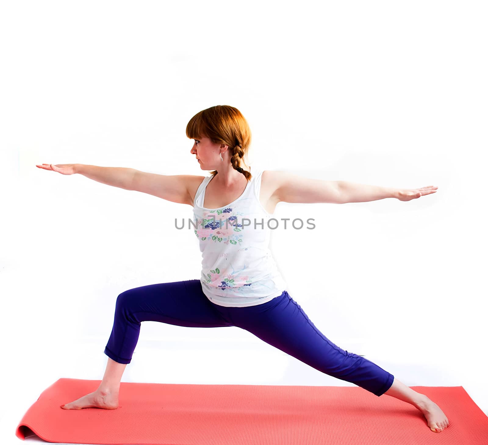 middle aged redhead woman exercising yoga isolated on white