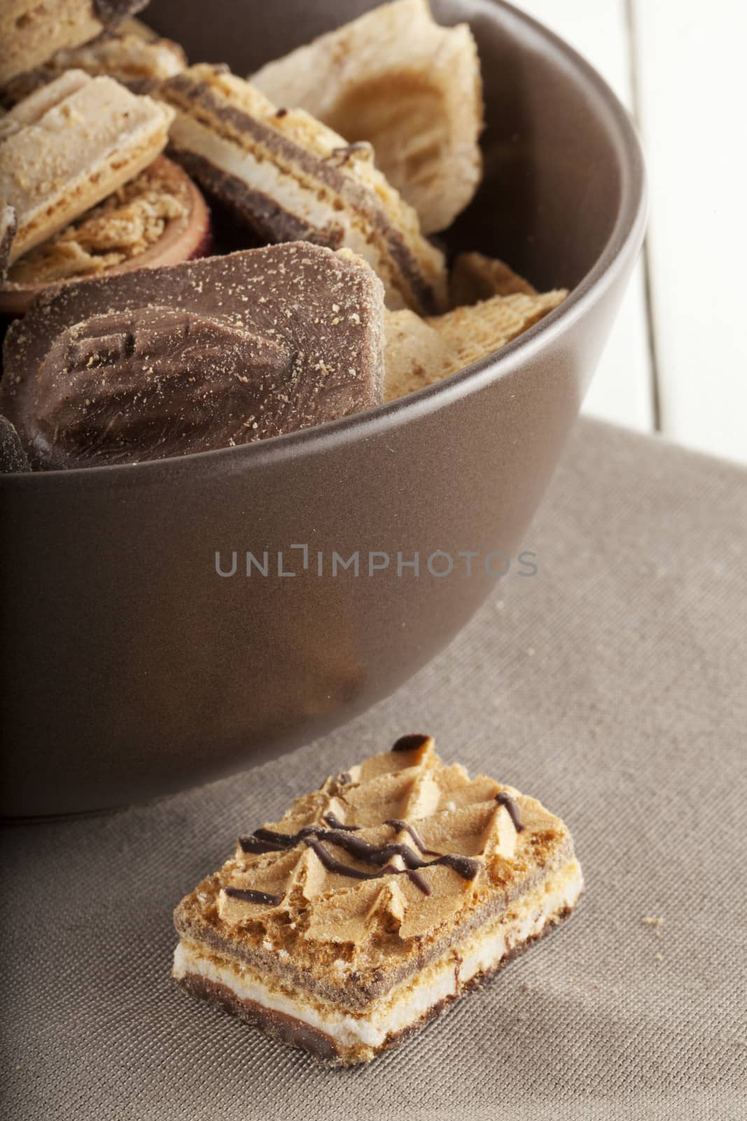 Assorted biscuits of different kind in a brown cup