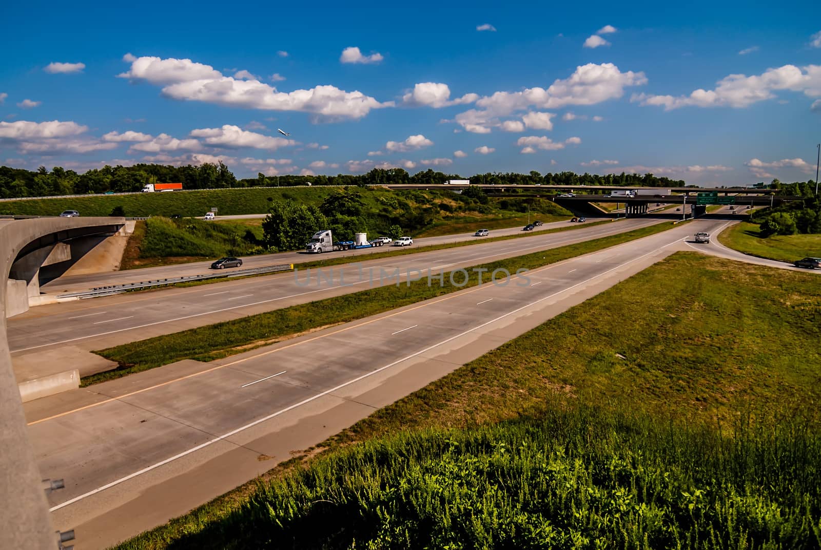 clover leaf exit ramps on highway near city by digidreamgrafix