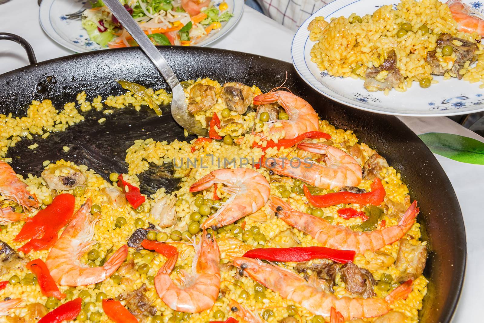 Traditional spanish paella cooked in a pan by doble.d