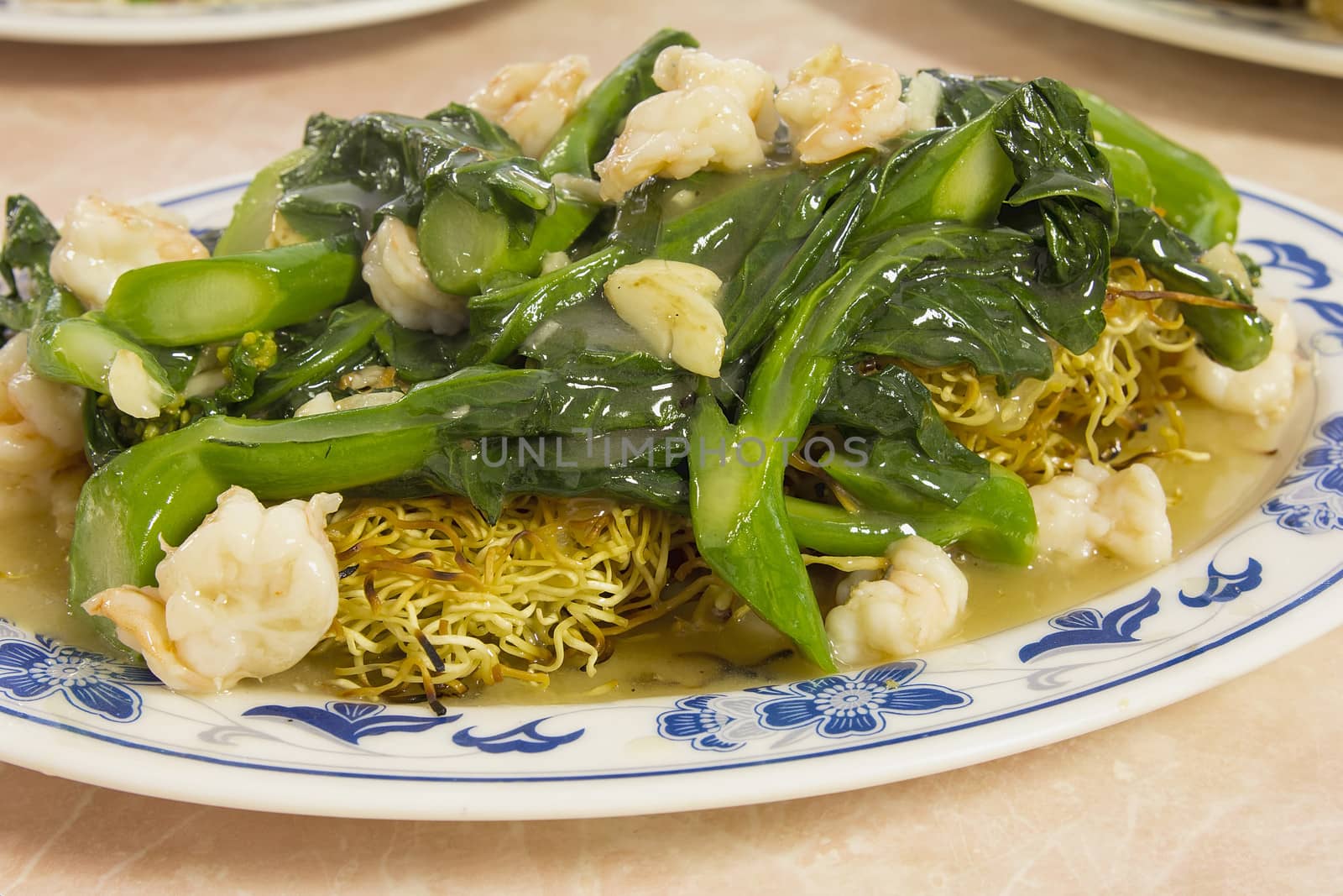 Chinese Fried Yellow Noodles with Prawns and Green Chinese Broccoli Vegetable