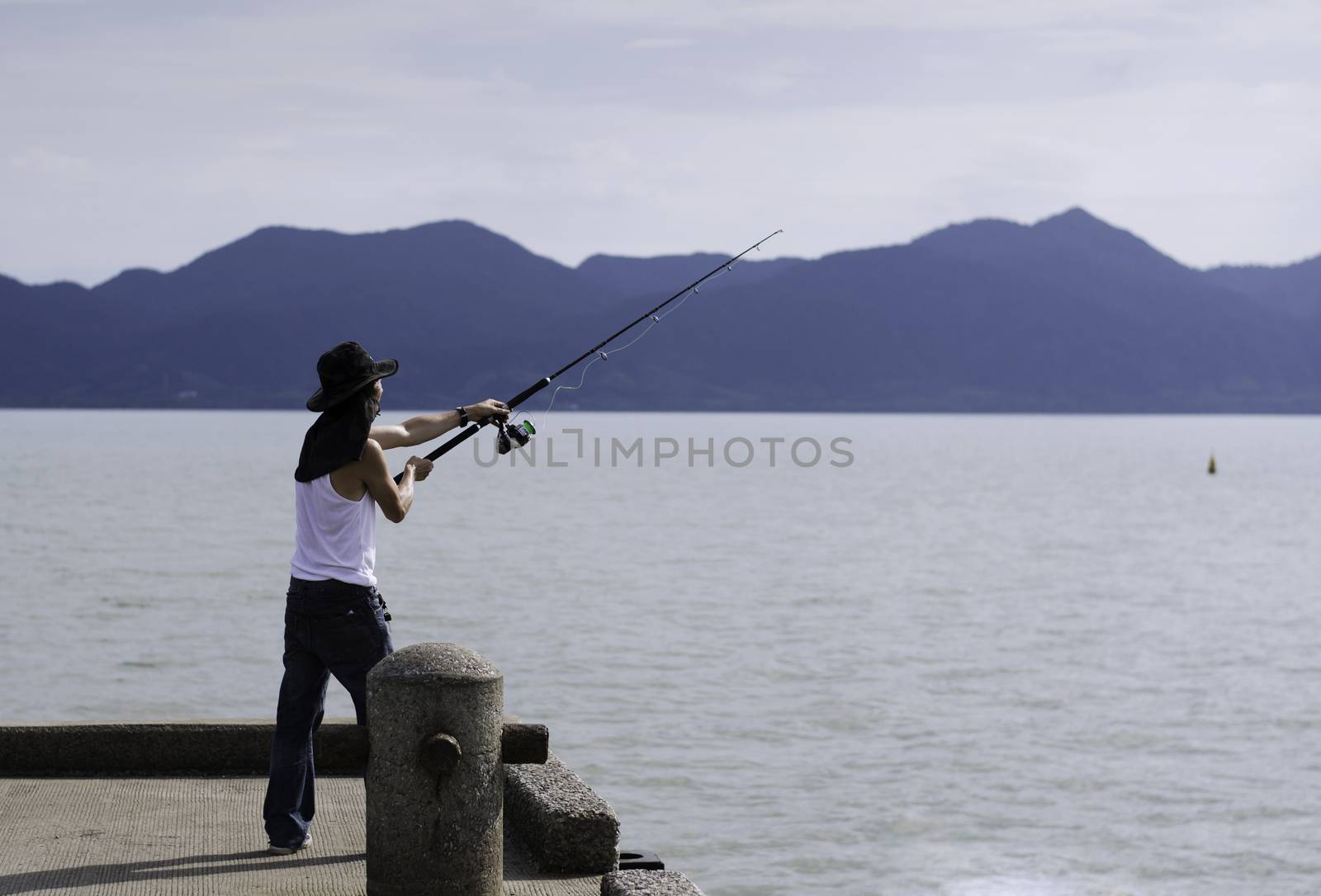 Fisherman fishing trolling in the sea, Chonburi, Thailand