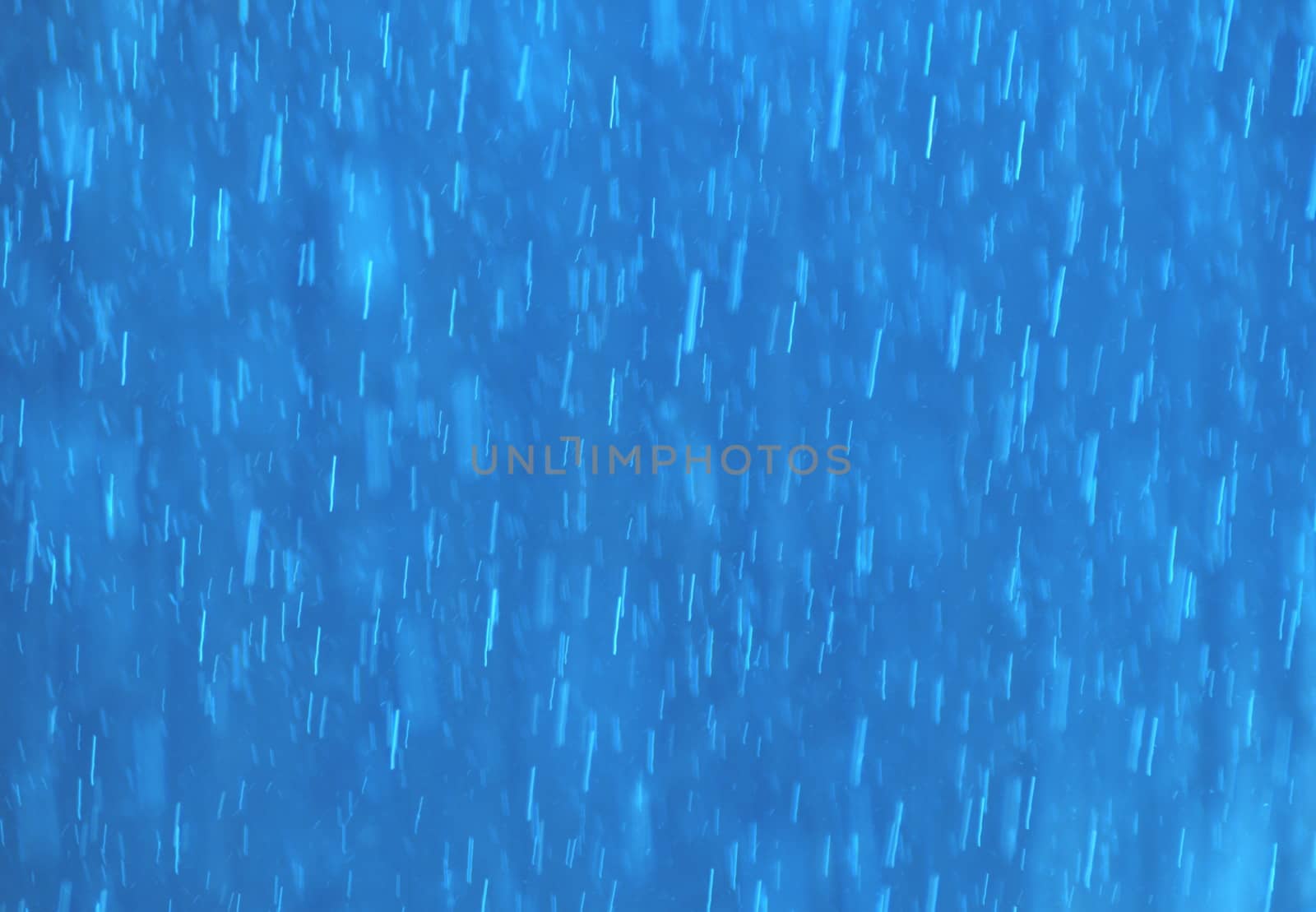 Abstract textured white bar rain on a blue background