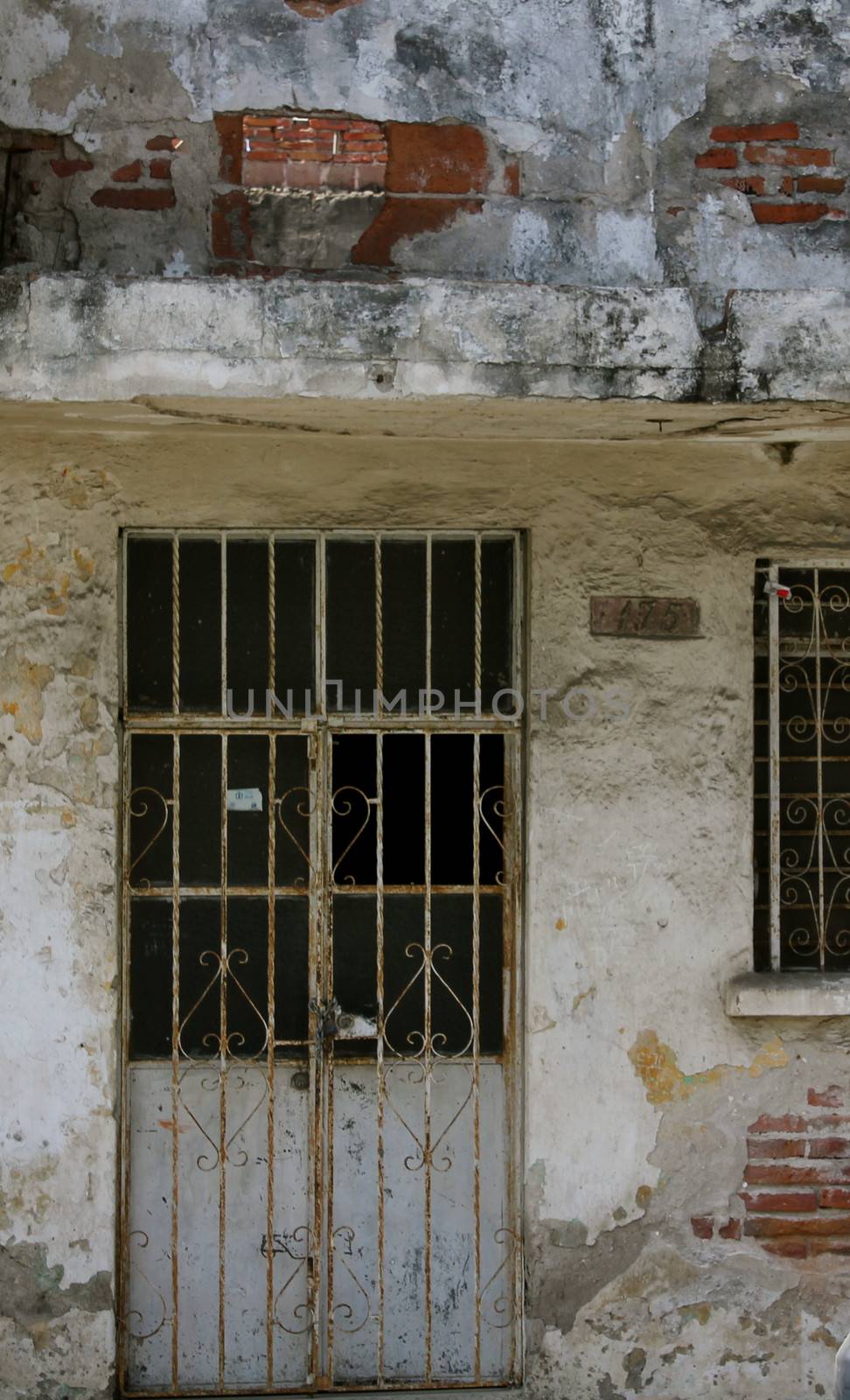 The exterior of an abandoned house prior to demolition.