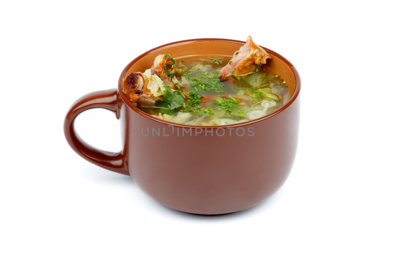 Vegetable Soup with Greens and Smoked Pork Ribs in Brown Soup Cup isolated on white background
