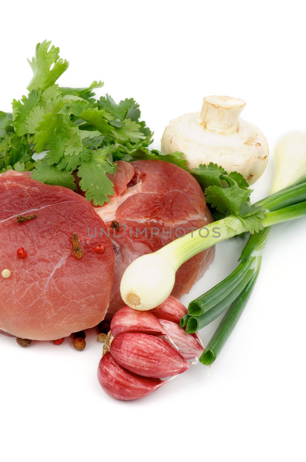 Perfect Boneless Raw Pork with Parsley, Spring Onion, Red Garlic, Edible Mushrooms and Spices isolated on white background