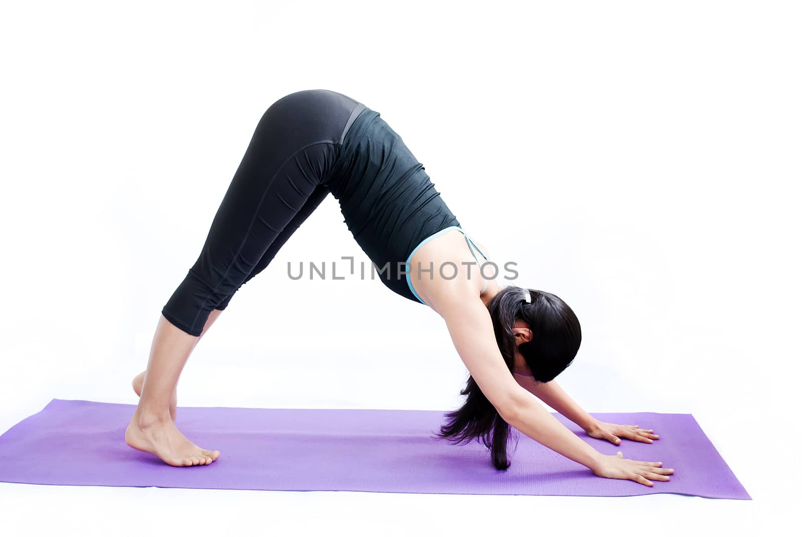 young brunette girl practising yoga isolated on white