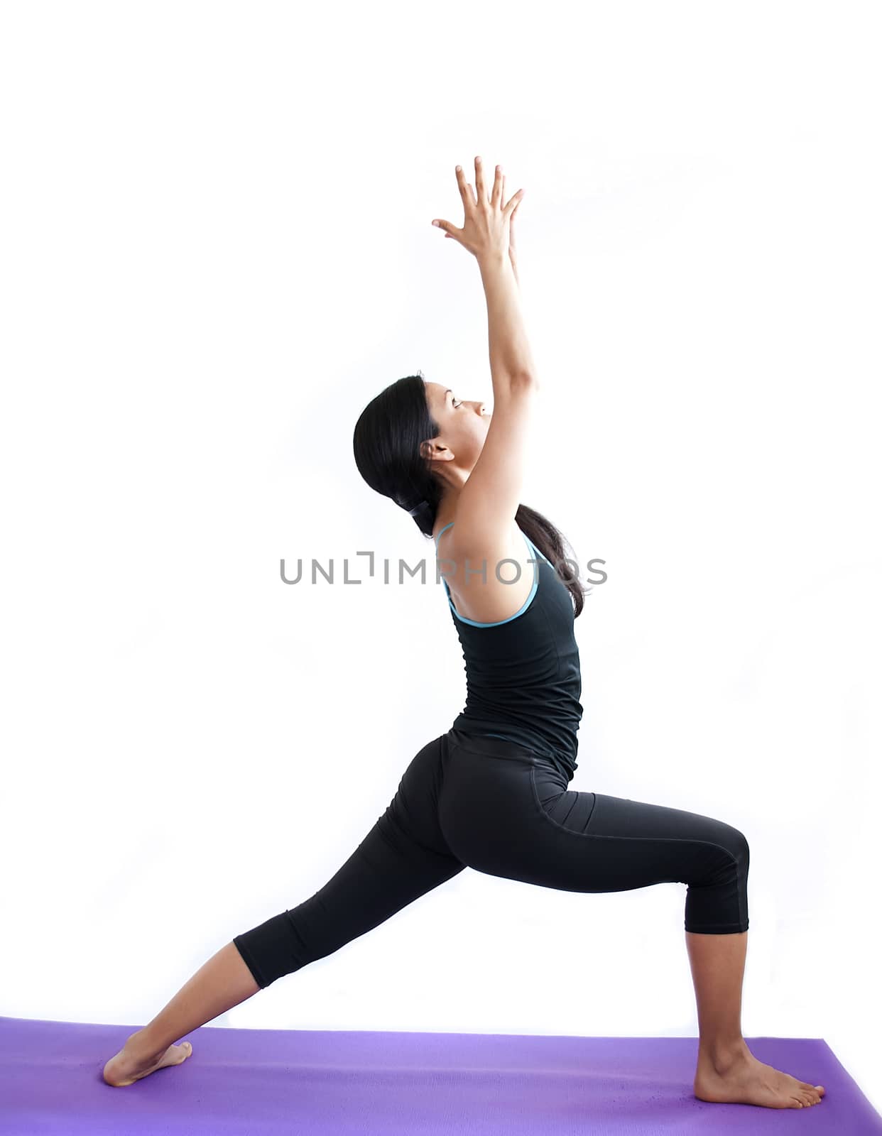 young brunette girl practising yoga isolated on white