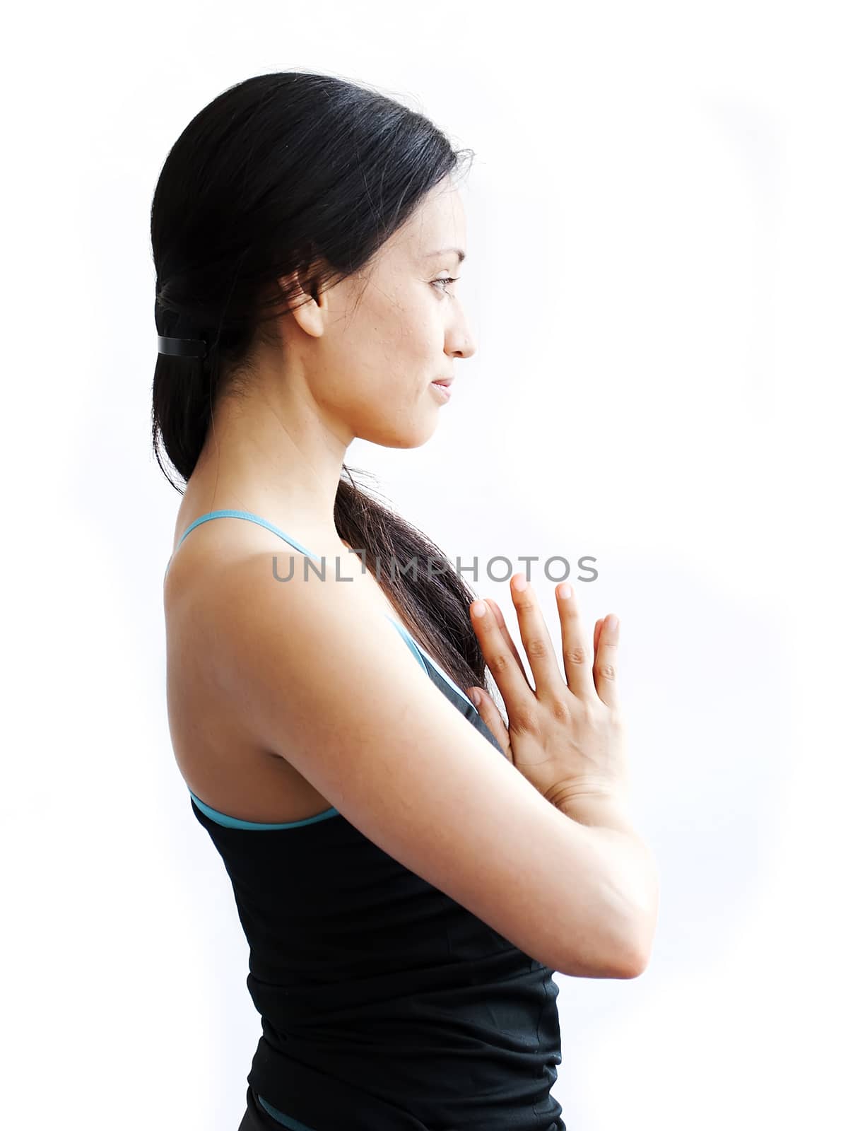 young brunette girl practising yoga isolated on white