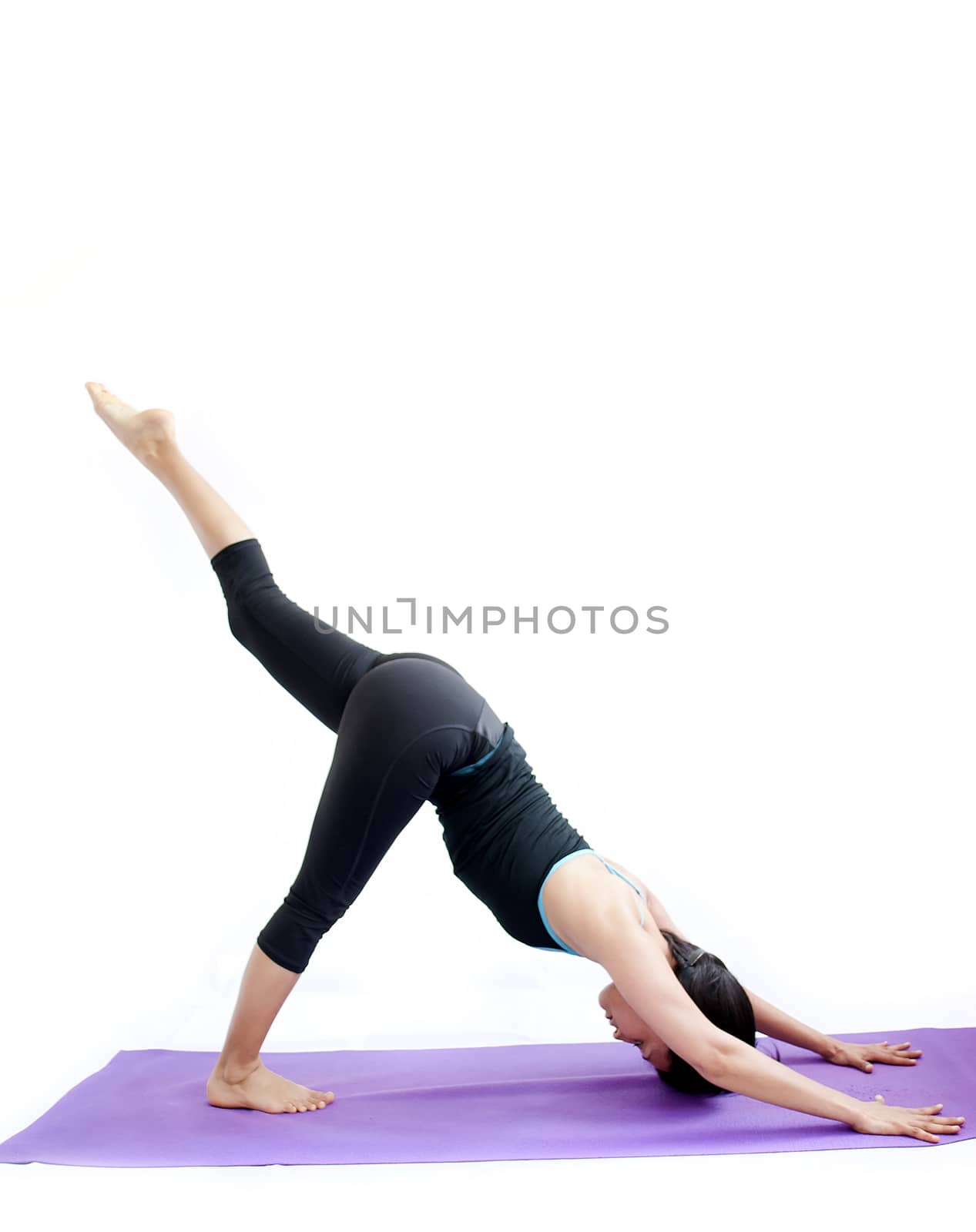 young brunette girl practising yoga isolated on white