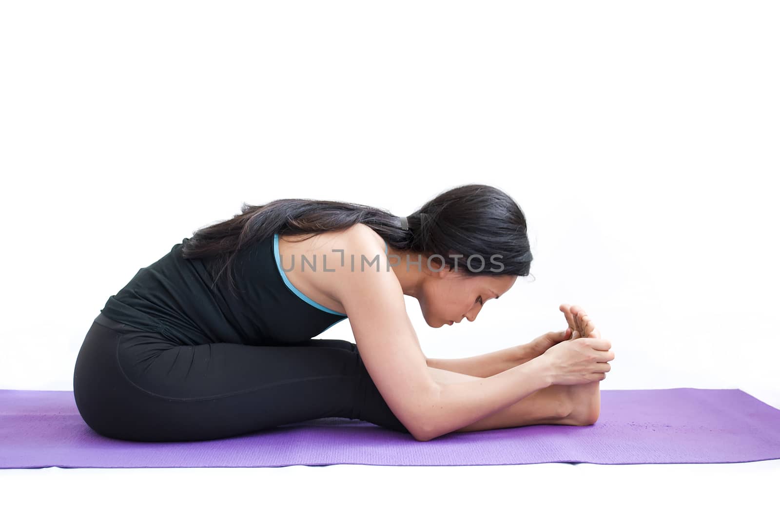 young brunette girl practising yoga isolated on white