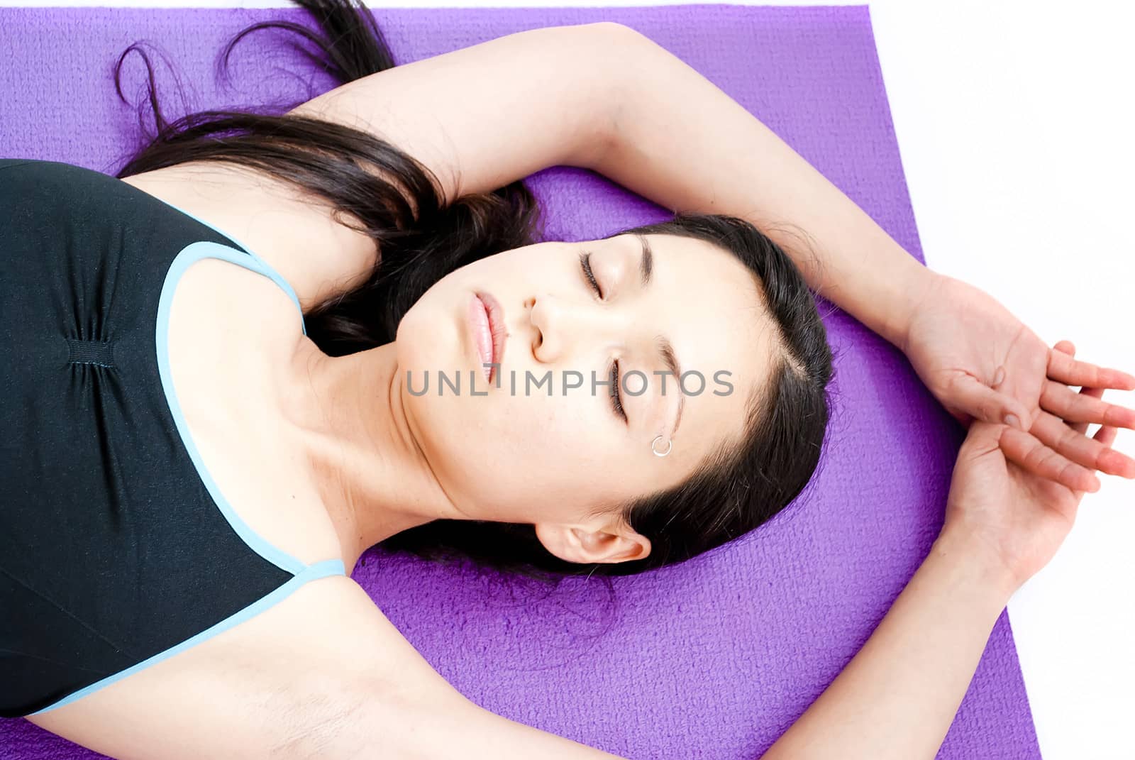 young brunette girl practising yoga isolated on white