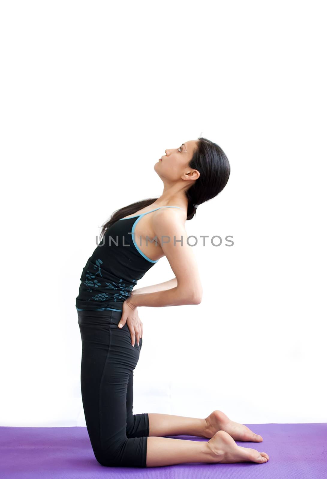 young brunette girl practising yoga isolated on white