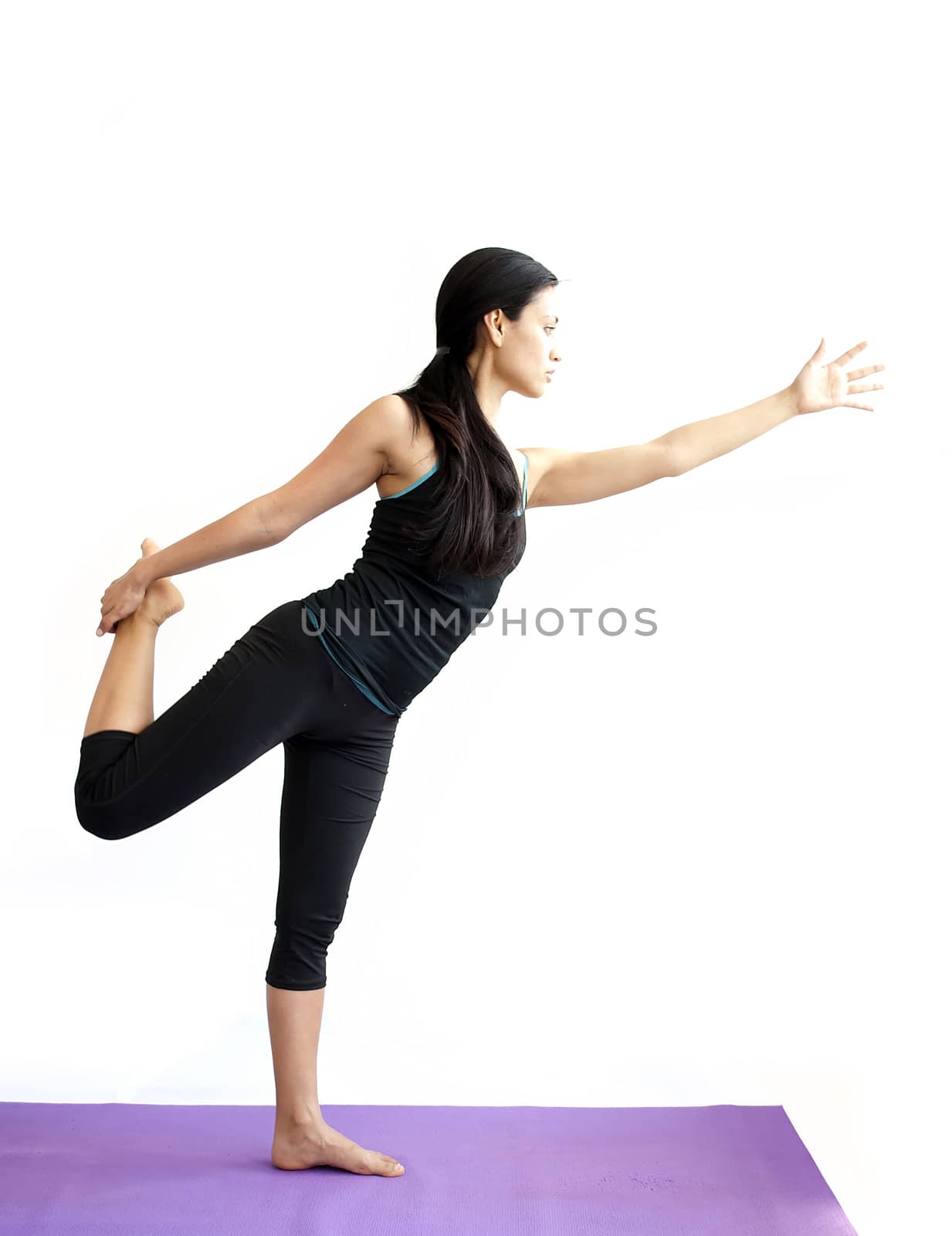 young brunette girl practising yoga isolated on white