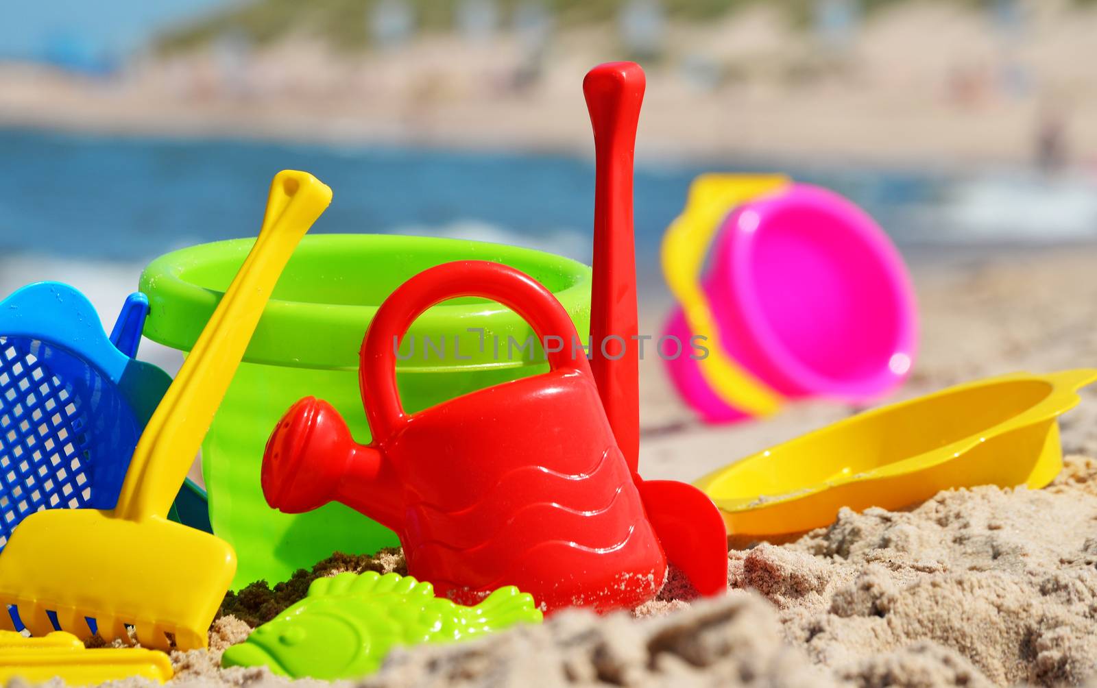 Plastic children toys on the sand beach