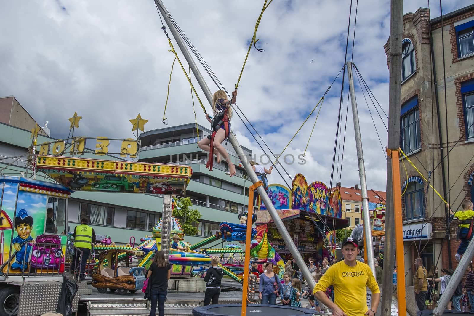 Kids have fun at the funfair on the square in Halden, Norway.