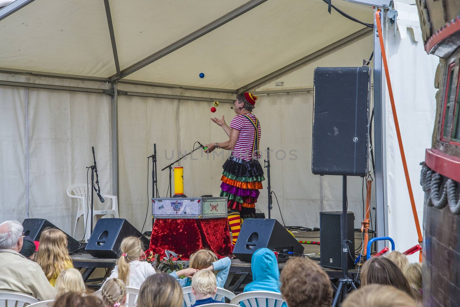 A skilled clown who entertains the kids with juggling, magic tricks and high jinks on Halden squares, Norway.