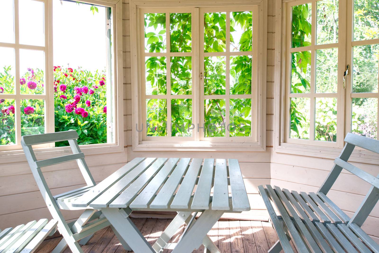 Summer house inside on sunny day by Nanisimova