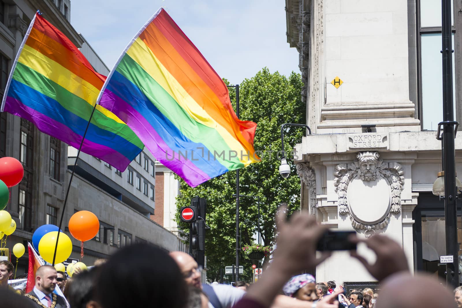 LONDON, UK - JUNE 29: Rainbow flags in front of department store Selfridges at the London Gay Pride parade in Oxford Street. June 29, 2013 in London.