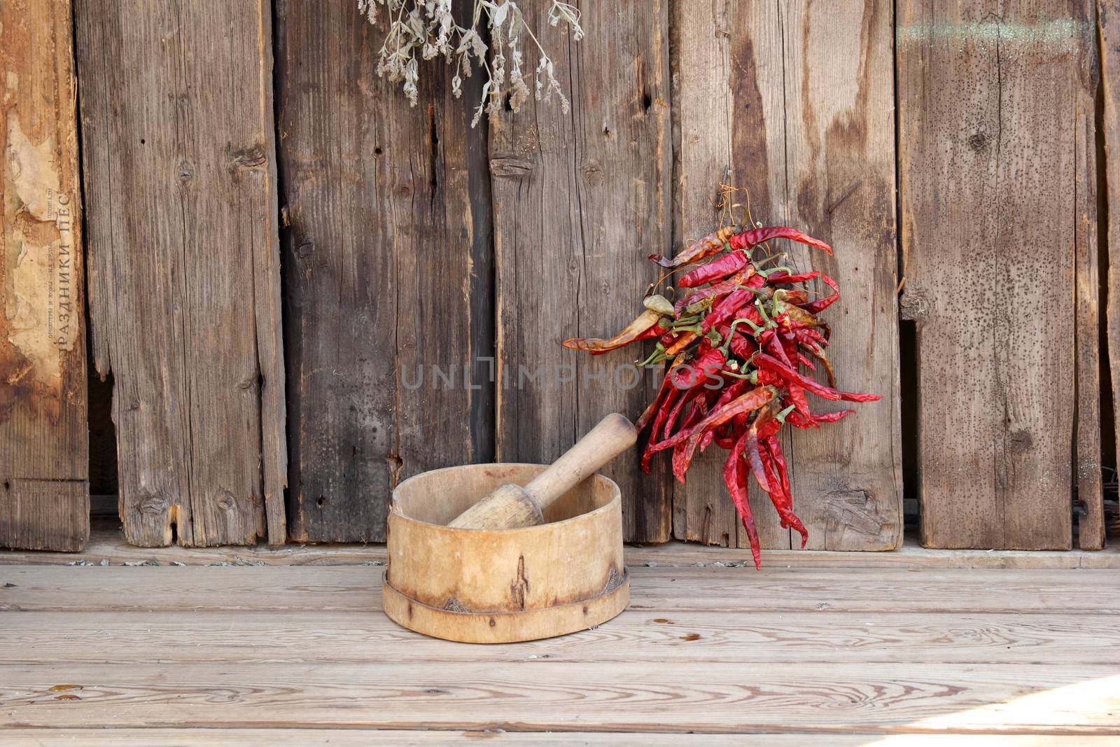 bunch of red pepper, a sieve and press