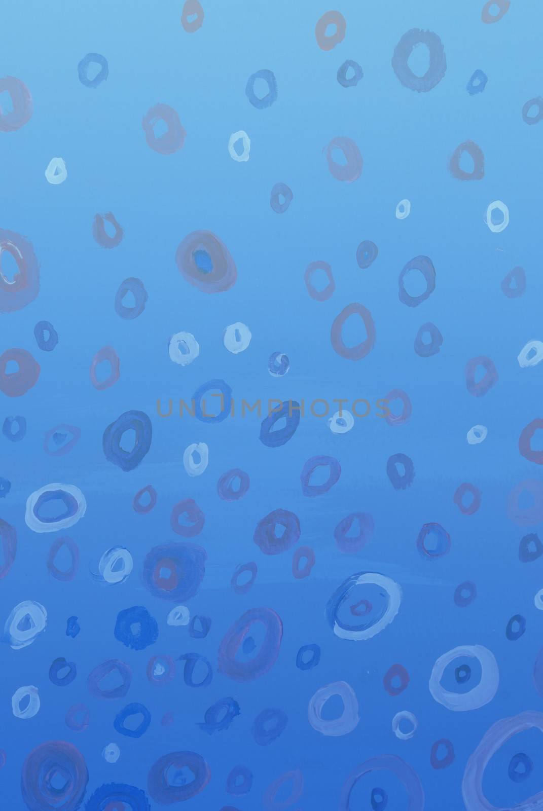 An abstract watercolor painting of circles surrounded by blue gradient wash. Property Release on file.