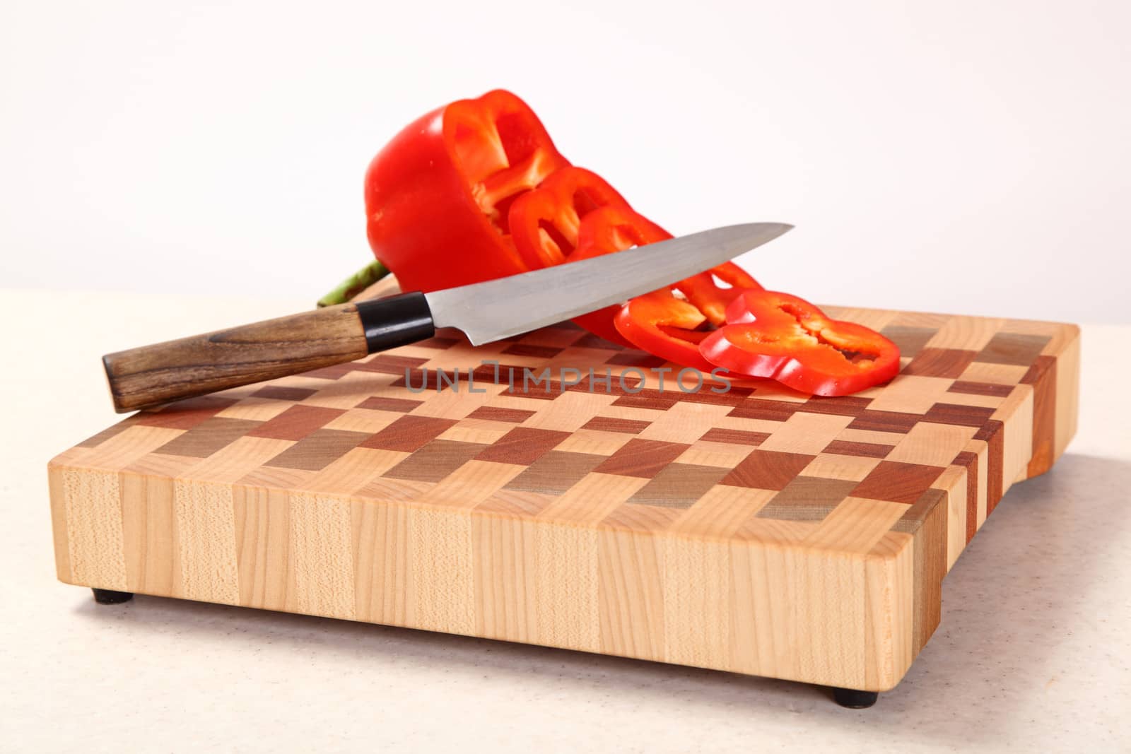 red pepper knifed on a chopping board