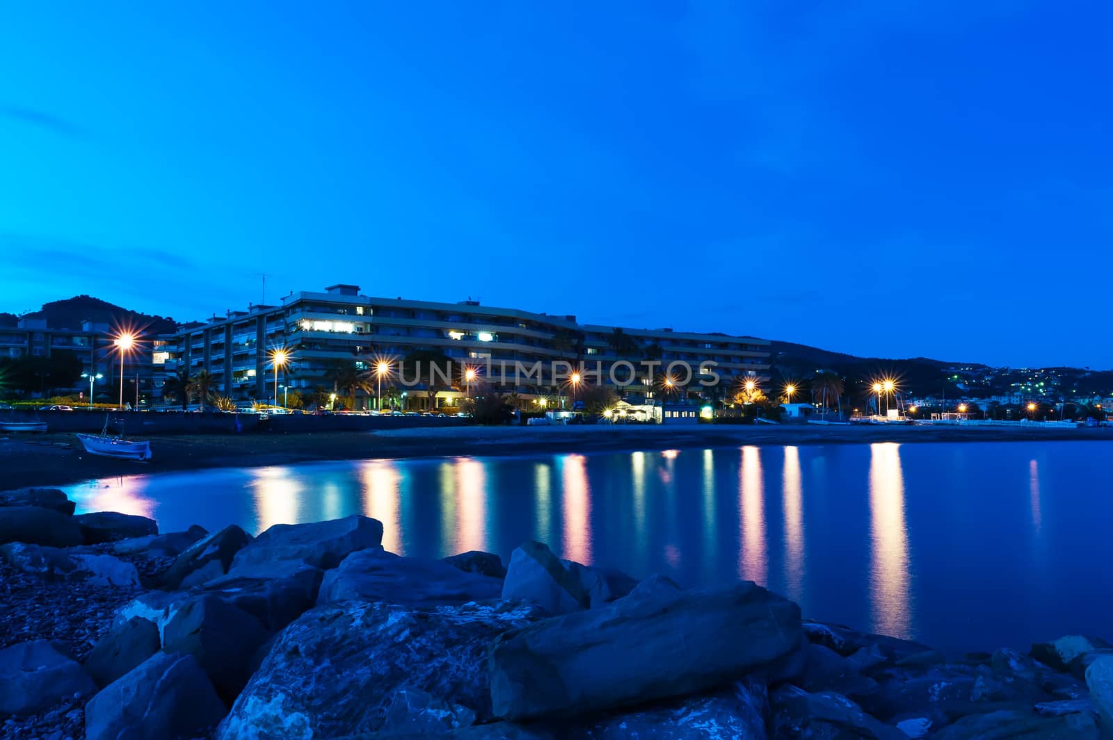 Night view of the waterfront city of Bordighera, Italy