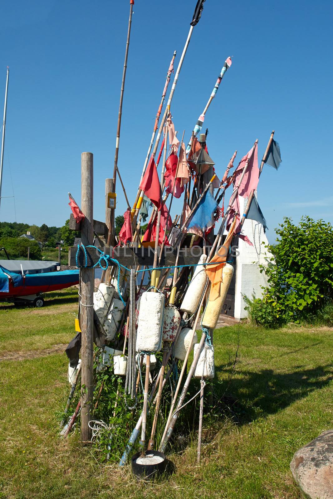 Fisherman flags and fishing equipment in a small port Denmark                               