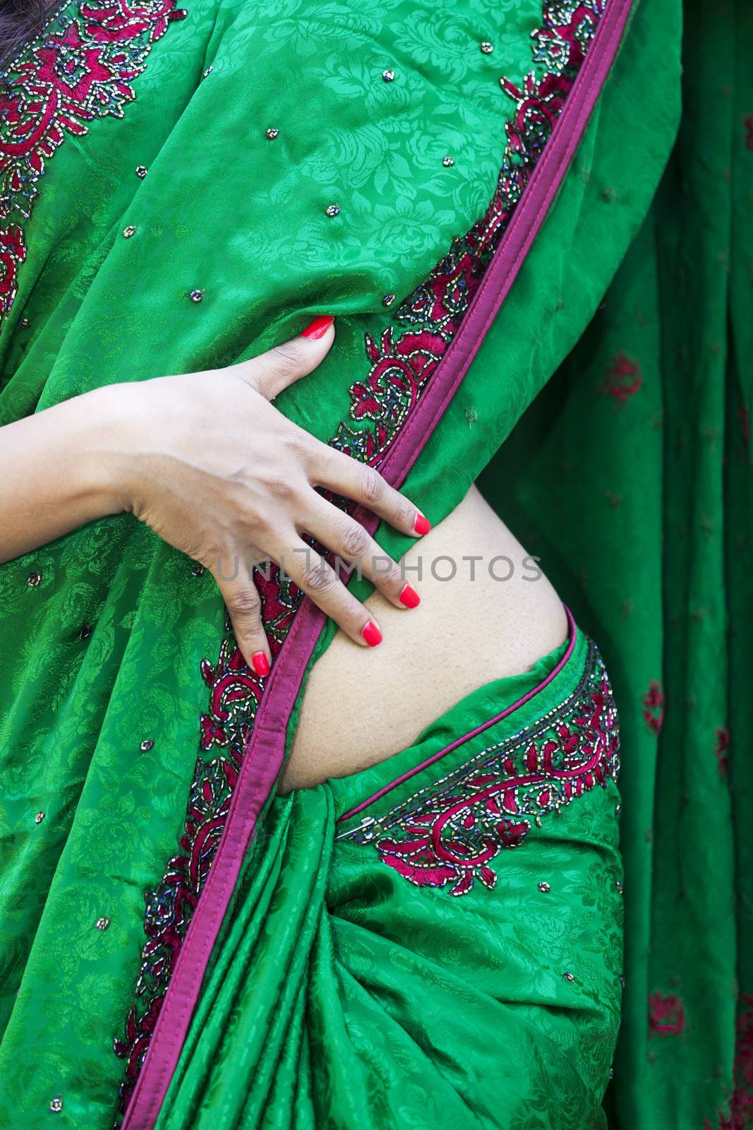 detail of a woman in a saree by bernjuer