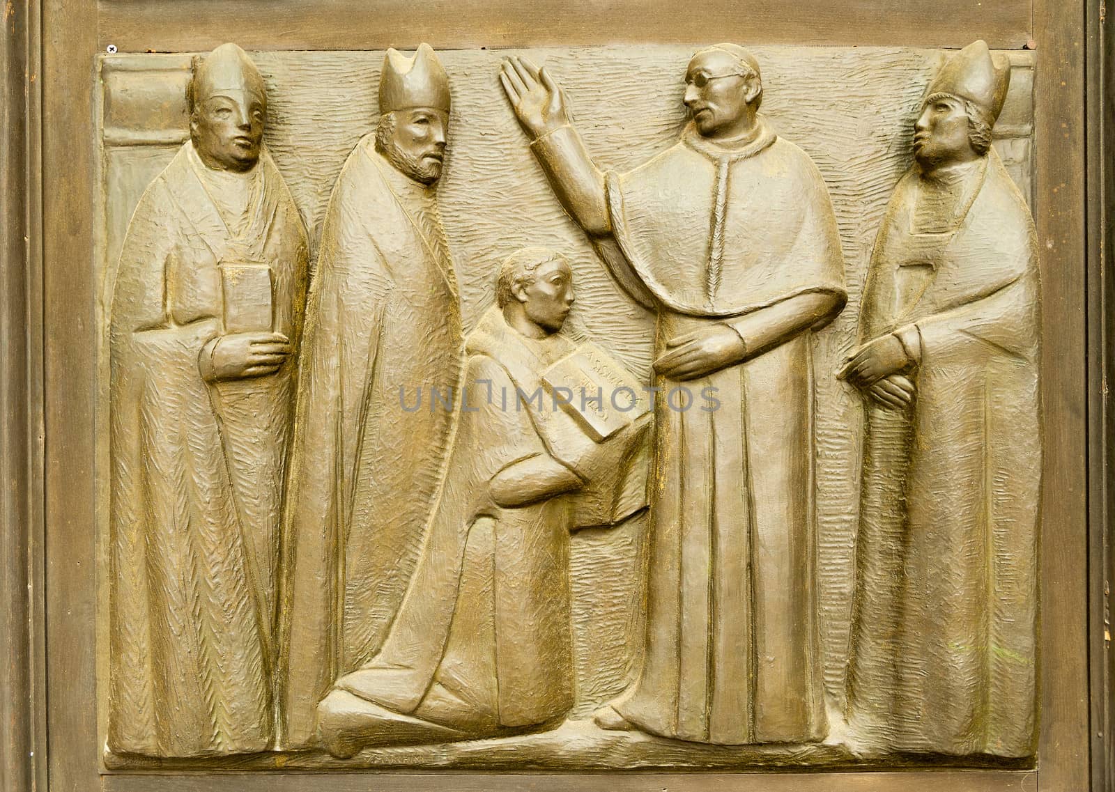 Bas-relief on the church doors the Saints Gervasio and Protasio Protasio in Domodossola, Italy