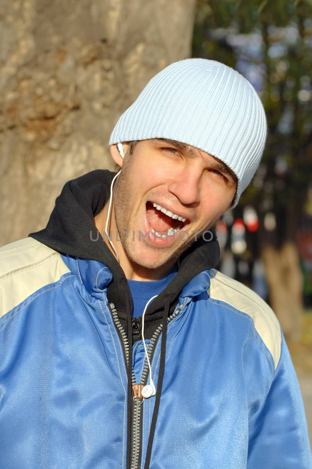 man with open mouth stand on the street