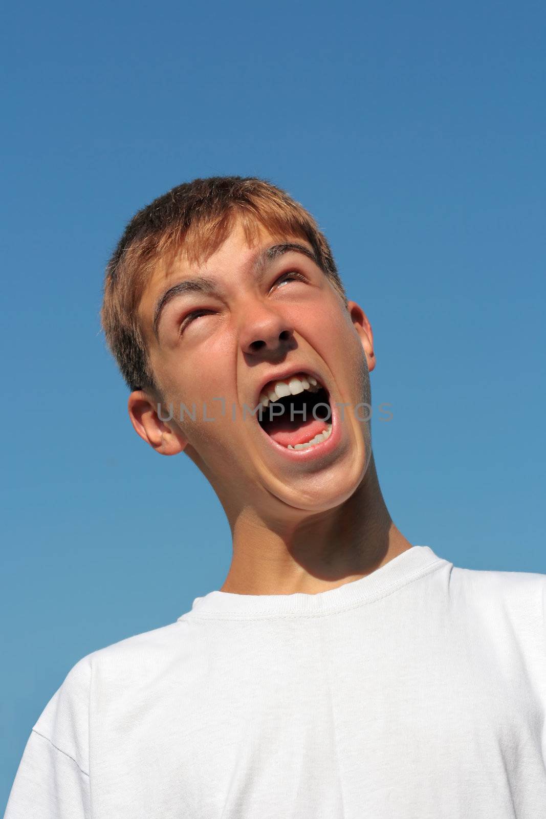 teenager screaming with mouth open